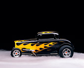 AUT 19 RK0226 09
1932 Ford Coupe Black With Flames Side View On Foggy Floor Studio