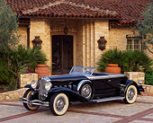 AUT 19 RK0252 05
1930 Black Duesenberg (Murphy Body) soft 3/4 front in driveway with house as background