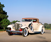 AUT 19 RK0253 04
1933 Packard V-12 Coupe White 3/4 Front View On Pavement Blue Sky