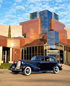 AUT 19 RK0325 04
1934 Cadillac V-16 Aerodynamic Coupe Purple 3/4 Side View In Front Of Museum Cloudy Blue Sky