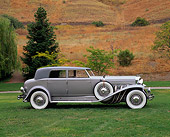 AUT 19 RK0340 01
1934 Duesenberg Model J Rollston Sport Sedan Profile Silver Sedan On Grass