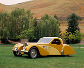 AUT 19 RK0345 03
1937 Bugatti Type 57 Atlante Coupe Two Tone Yellow 3/4 Front View On Grass