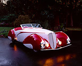AUT 19 RK0371 06
1937 Delahaye Type 135 Competition Court Built By Figoni And Falaschi Red And Gray 3/4 Side On Wet Pavement