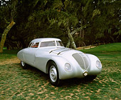 AUT 19 RK0428 02
1937 Adler Rennlimousine Competition Coupe Silver 3/4 Front View On Grass By Trees Pebble Beach