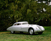 AUT 19 RK0429 02
1937 Adler Rennlimousine Competition Coupe Silver 3/4 Front View On Grass By Trees Pebble Beach