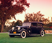 AUT 19 RK0439 02
1932 Lincoln V-12 KB Sedan Black 3/4 Front View On Grass By Trees Filtered