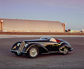 AUT 19 RK0502 03
1937 Alfa Romeo 2900B Spider 8C Black 3/4 Front View On Pavement Airplane Hanger Background
