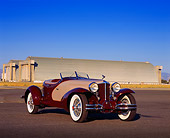 AUT 19 RK0535 05
1931 Cord L29 Speedster Burgundy And Beige 3/4 Front View On Pavement By Airplane Hanger