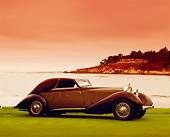 AUT 19 RK0545 01
1934 Hispano-Suiza J12 Coupe de Ville Blue And Gray 3/4 Front View By Water Filtered