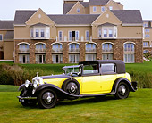 AUT 19 RK0574 05
1931 Rolls Royce Phantom II Black And Yellow 3/4 Front View On Grass By Mansion