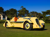 AUT 19 RK0666 01
1935 Duesenberg SJ Speedster Yellow Front 3/4 Grass Blue Sky Trees
