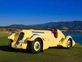 AUT 19 RK0669 01
1935 Duesenberg SJ Speedster Yellow Front 3/4 On Grass Sky Water Mountain