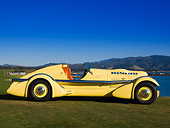 AUT 19 RK0672 01
1935 Duesenberg SJ Speedster Yellow Profile On Grass Sky Water Mountain