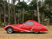 AUT 19 RK0696 01
1938 Talbot-Lago T150C SS Teardrop Coupe Red Profile View On Dirt By Trees