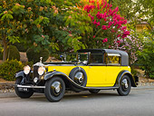 AUT 19 RK0703 01
1931 Rolls-Royce Phantom II Yellow And Black 3/4 Front View On Pavement By Trees