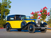 AUT 19 RK0707 01
1931 Rolls-Royce Phantom II Yellow And Black 3/4 Front View On Pavement By Trees