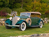 AUT 19 RK0724 01
1933 Lincoln KB Sport Phaeton Green 3/4 Front View On Grass By Trees
