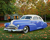 AUT 20 BK0005 01
1947 Buick Sedanette Blue And White 3/4 Front View On Grass By House And Autumn Trees