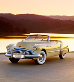 AUT 20 RK0083 08
1949 Buick Roadmaster Convertible Yellow Front 3/4 View On Road By Water At Dusk