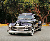 AUT 20 RK0280 01
1946 Plymouth Coupe Purple Front 3/4 View On Pavement By Trees