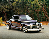 AUT 20 RK0282 02
1946 Plymouth Coupe Purple Side 3/4 View On Pavement By Trees