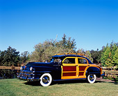 AUT 20 RK0285 01
1947 Chrysler Town And Country Woody Green 3/4 Side View On Grass By Trees