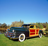 AUT 20 RK0286 01
1947 Chrysler Town And Country Woody Green 3/4 Front View On Grass By Trees