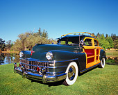 AUT 20 RK0287 01
1947 Chrysler Town And Country Woody Green 3/4 Front View On Grass By Trees
