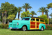 AUT 20 RK0291 01
1942 Ford Woodie Green 3/4 Side View On Grass By Trees