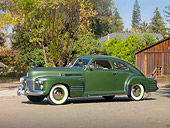 AUT 20 RK0385 01
1941 Cadillac Series 61 Coupe Green 3/4 Front View On Pavement By Trees