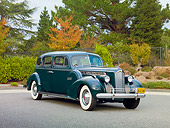 AUT 20 RK0417 01
1940 Packard 160 Touring Sedan 1804 Green 3/4 Front View On Pavement By Trees