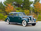 AUT 20 RK0418 01
1940 Packard 160 Touring Sedan 1804 Green 3/4 Front View On Pavement By Trees