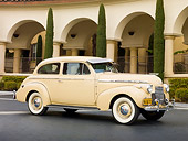 AUT 20 RK0424 01
1940 Chevrolet Special Deluxe Coupe Tan 3/4 Side View On Pavement By Building