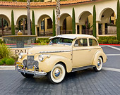 AUT 20 RK0428 01
1940 Chevrolet Special Deluxe Coupe Tan 3/4 Front View On Pavement By Building