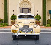 AUT 20 RK0430 01
1940 Chevrolet Special Deluxe Coupe Tan Front View On Pavement By Building