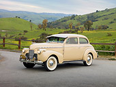 AUT 20 RK0433 01
1940 Chevrolet Special Deluxe Coupe Tan 3/4 Front View On Pavement By Grassy Hills