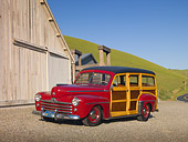AUT 20 RK0473 01
1947 Ford Woodie Red 3/4 Front View On Gravel By Barn