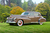 AUT 20 RK0530 01
1941 Cadillac Fleetwood 60 Special Sedan Brown 3/4 Side View On Grass By Trees