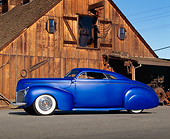 AUT 20 RK0540 01
1940 Mercury Coupe Blue Profile View On Pavement By Old Wooden Barn