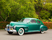 AUT 20 RK0551 01
1941 Pontiac Torpedo Streamliner Two-Tone Green 3/4 Side View On Pavement By Trees