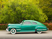 AUT 20 RK0552 01
1941 Pontiac Torpedo Streamliner Two-Tone Green Profile View On Pavement By Trees