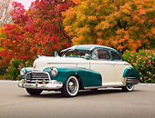 AUT 20 RK0554 01
1946 Chevrolet Fleetmaster White Pearl And Forest Green 3/4 Front View On Pavement By Trees