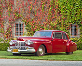 AUT 20 RK0587 01
1948 Lincoln Continental Coupe Maroon 3/4 Front View On Grass By House
