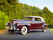 AUT 20 RK0589 01
1941 Buick Roadmaster Phaeton 71C Titan Maroon 3/4 Front View On Pavement By Trees