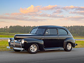 AUT 20 RK0610 01
1942 Ford 2-Door Sedan Black 3/4 Side View On Pavement By Grass And Trees At Dusk