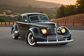 AUT 20 RK0611 01
1941 Graham Hollywood Green 3/4 Front View On Pavement By Hills At Dusk