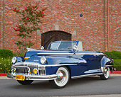 AUT 20 RK0617 01
1948 DeSoto Custom Regal Blue 3/4 Front View On Pavement By Building
