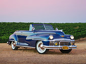 AUT 20 RK0629 01
1948 DeSoto Custom Regal Blue 3/4 Side View On Grass By Vineyard At Dusk