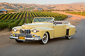 AUT 20 RK0644 01
1947 Lincoln Continental Yellow 3/4 Front View On Pavement By Vineyard