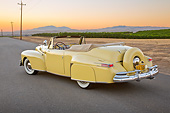 AUT 20 RK0647 01
1947 Lincoln Continental Yellow 3/4 Rear View On Pavement By Vineyard At Dusk
